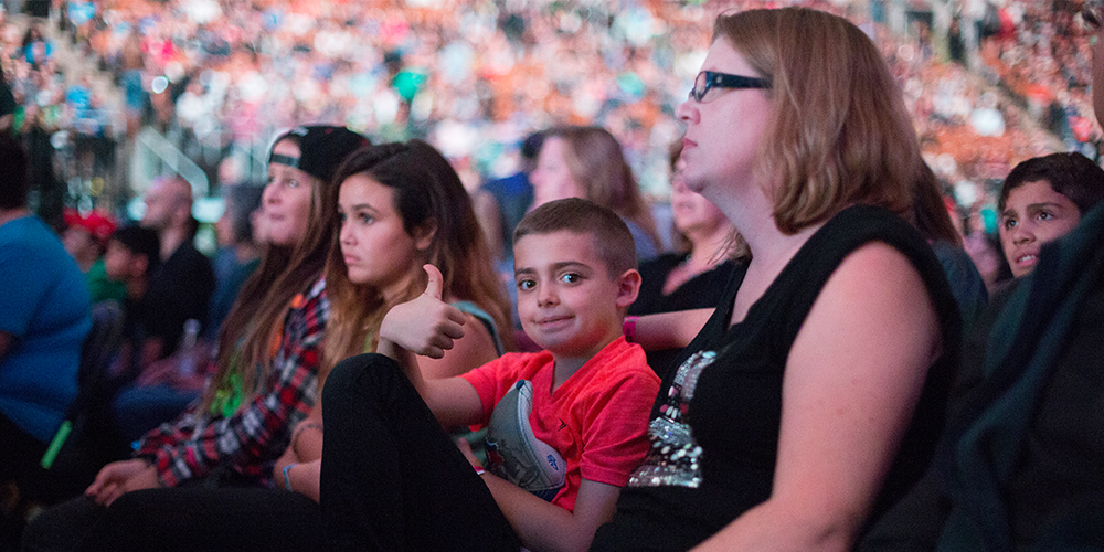 A family sits together at WE Day