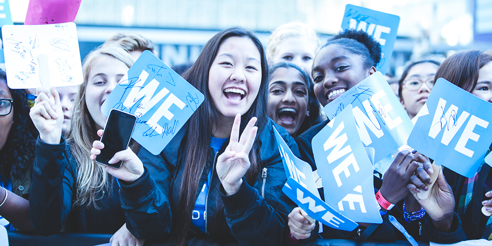 WE Day attendees anticipate celebrities on the red carpet